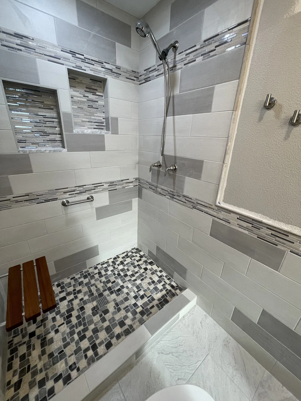 Custom shower with contrasting gray wall tiles
