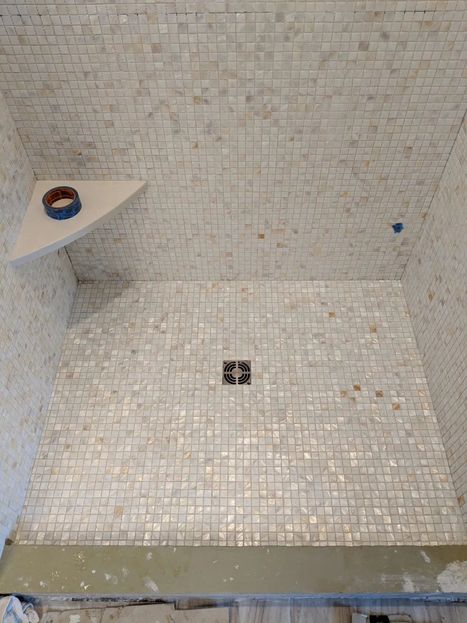 Mosaic shower floor and corner bench