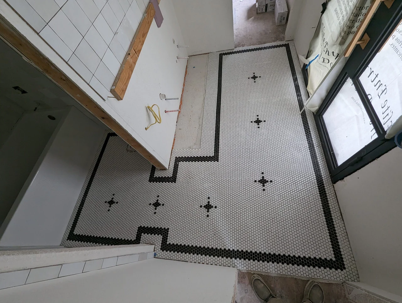 Decorative tile floor border following the shape of the room