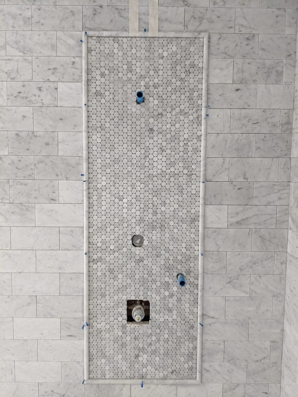 Tiled shower with a mosaic feature strip