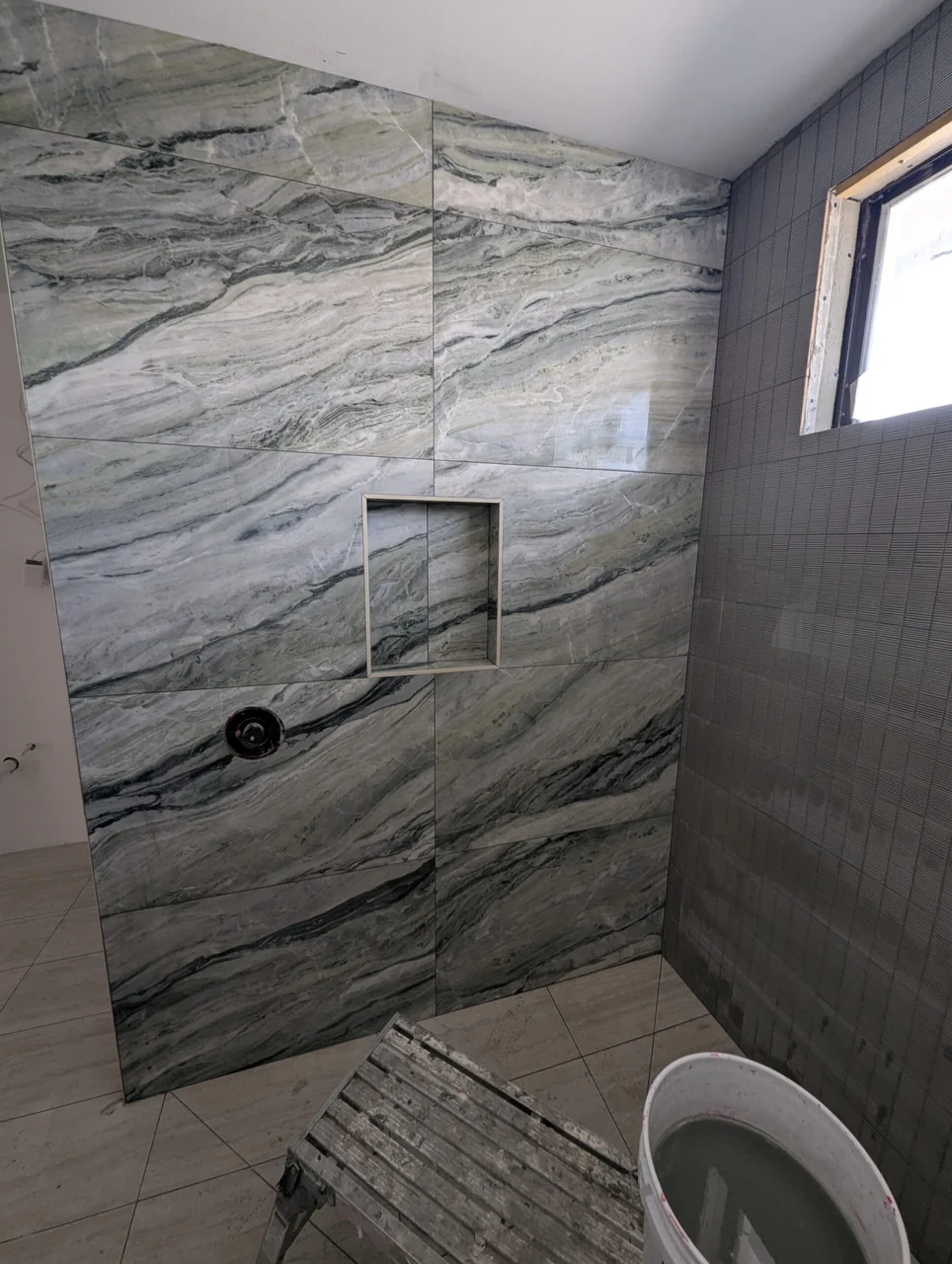 Dramatically veined shower feature wall
